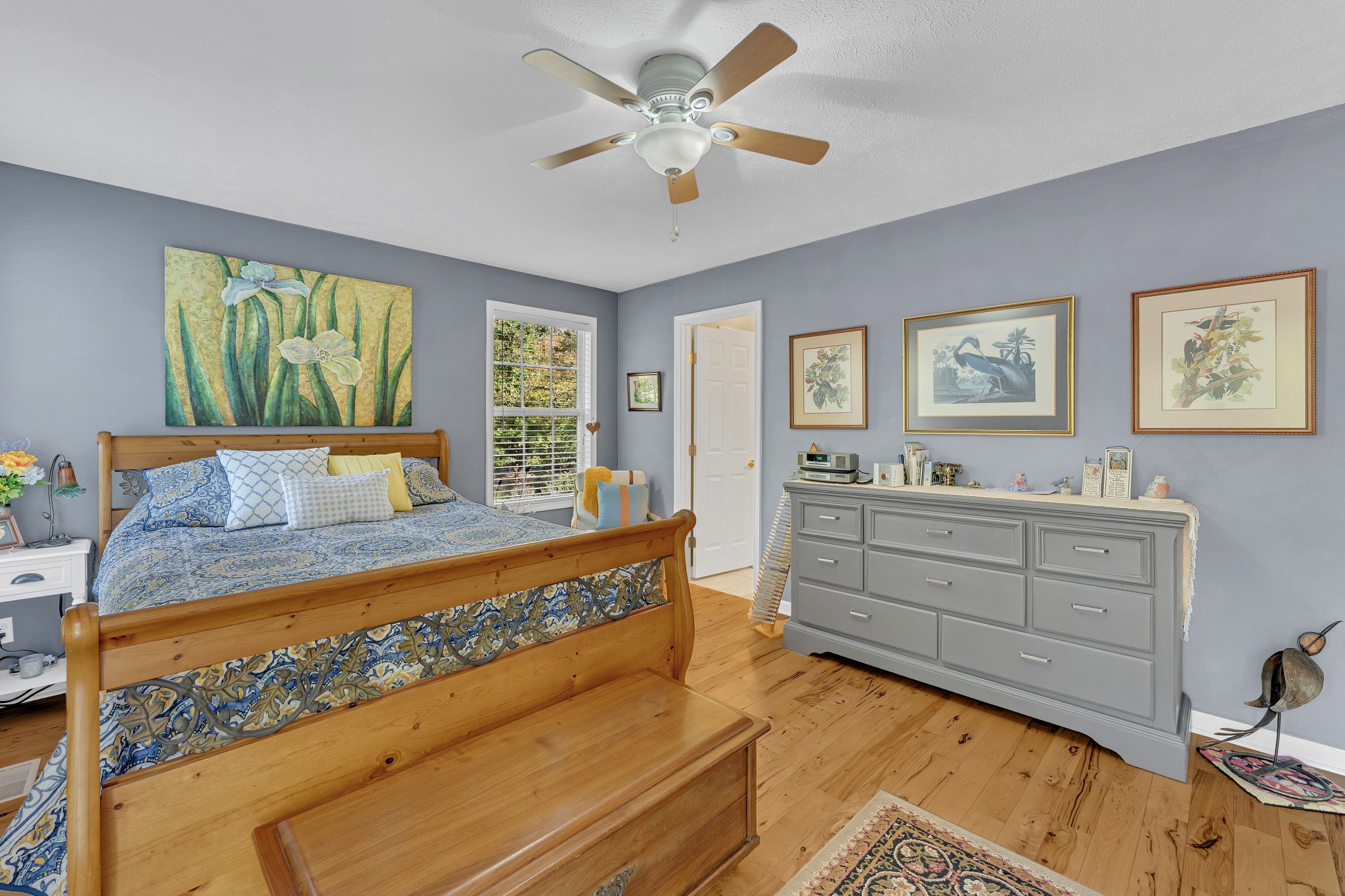 1475 Petty Road White Bluff, TN 37187 - Photo 15 of 55 a bed room with a bed and paintings on the wall