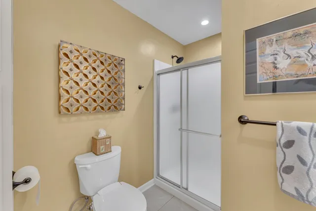 a bathroom with a toilet sink and shower