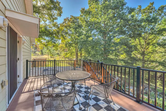 a view of a chair and table in the balcony