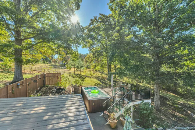 a view of a patio with table and chairs and potted plants