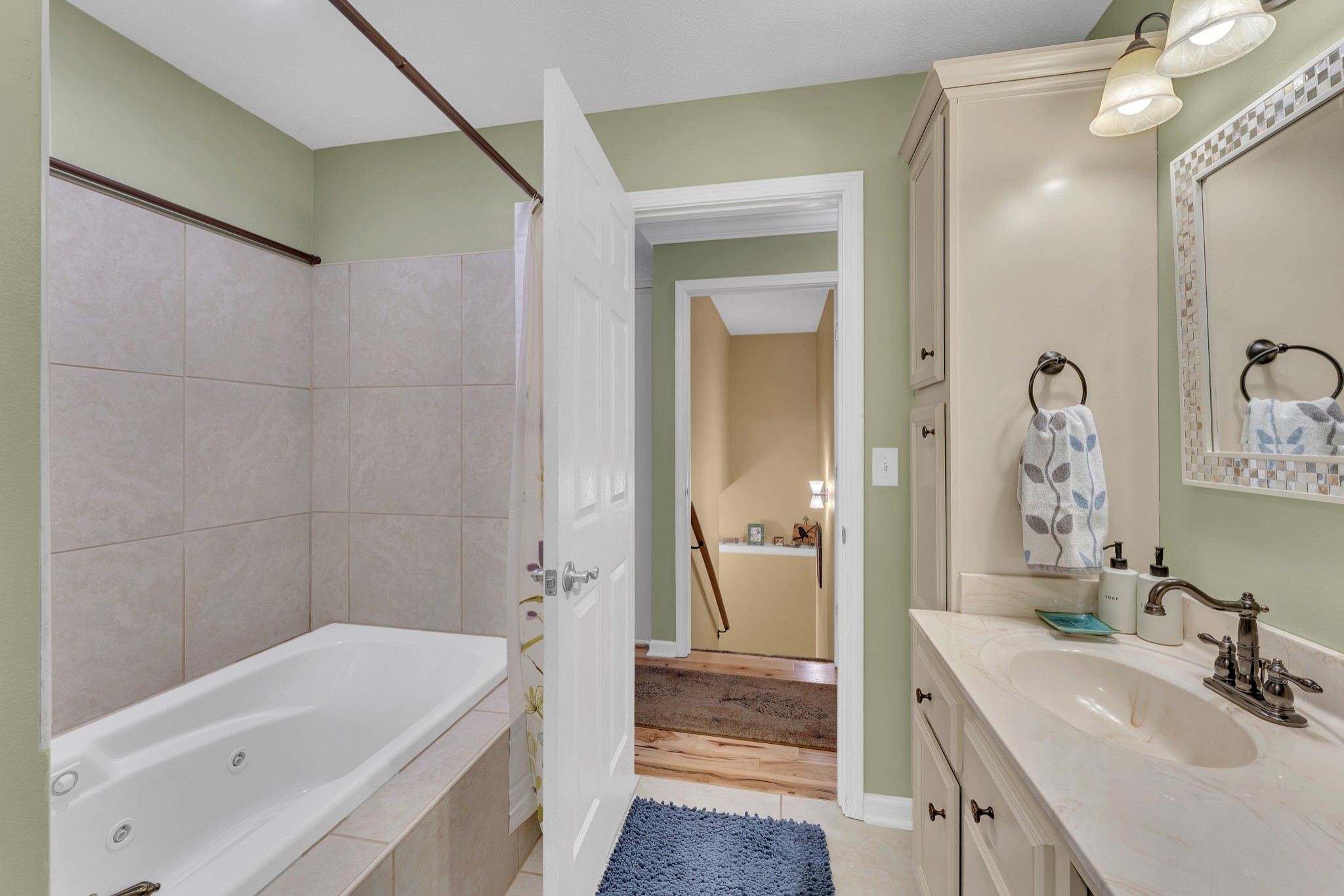 1475 Petty Road White Bluff, TN 37187 - Photo 24 of 55 a bathroom with a tub sink and mirror