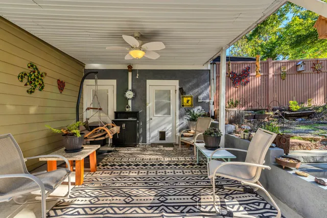 a view of a yard with plants and a patio