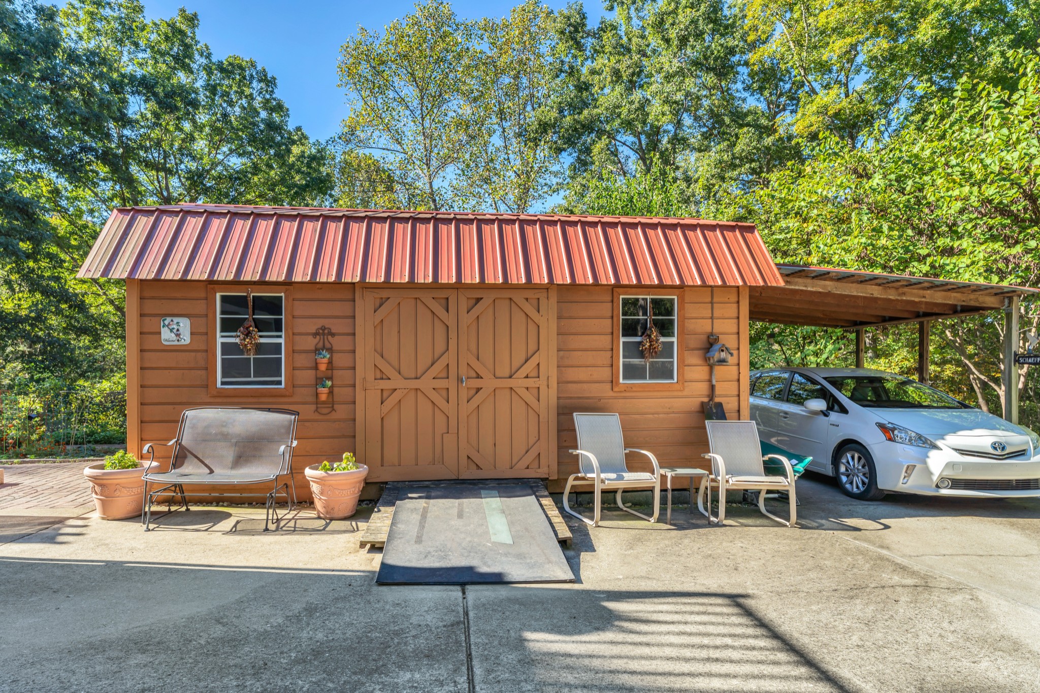 1475 Petty Road White Bluff, TN 37187 - Photo 39 of 55 a view of a patio with table and chairs with wooden floor and fence