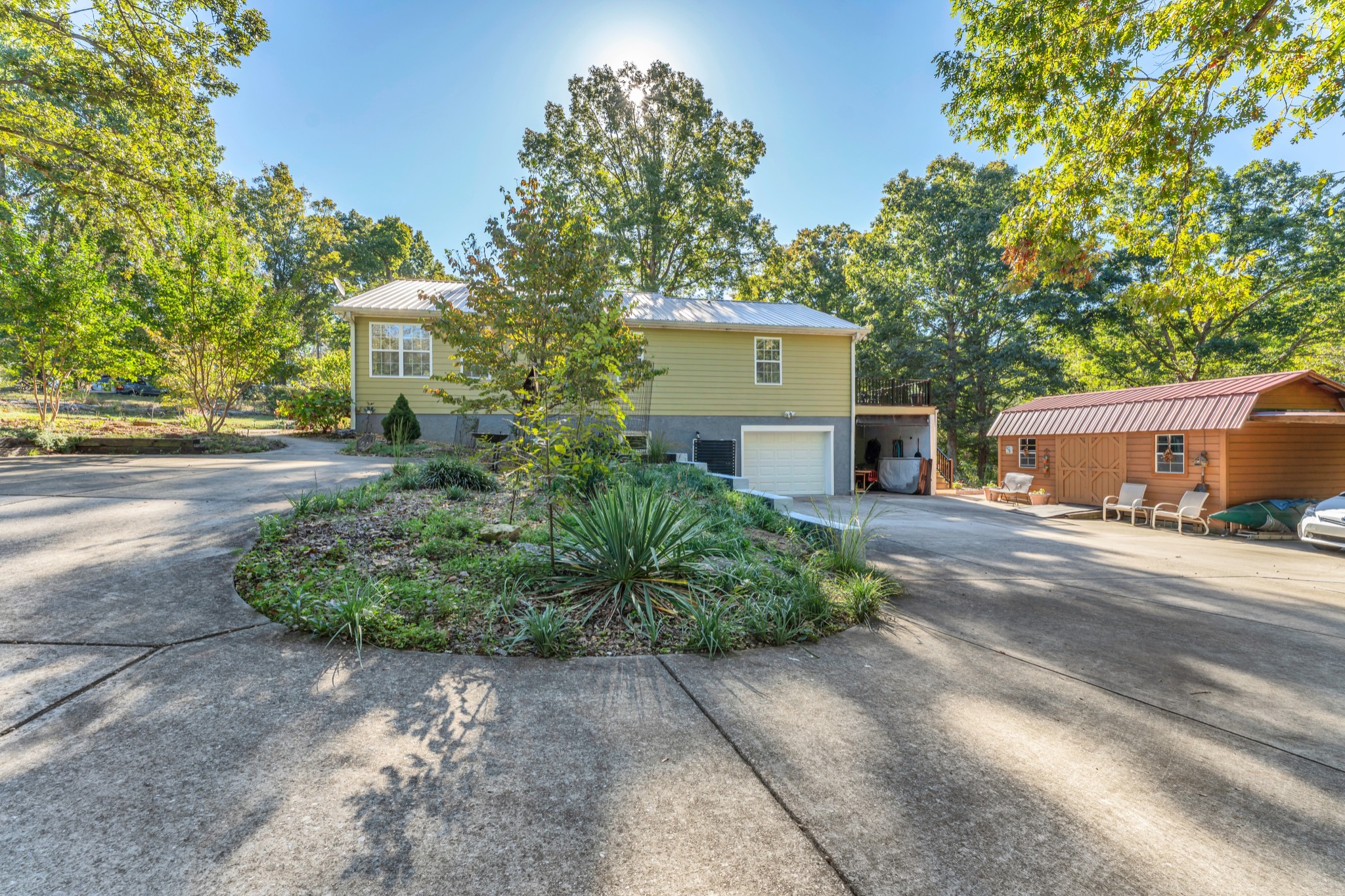 1475 Petty Road White Bluff, TN 37187 - Photo 41 of 55 a front view of a house with a yard and a garage