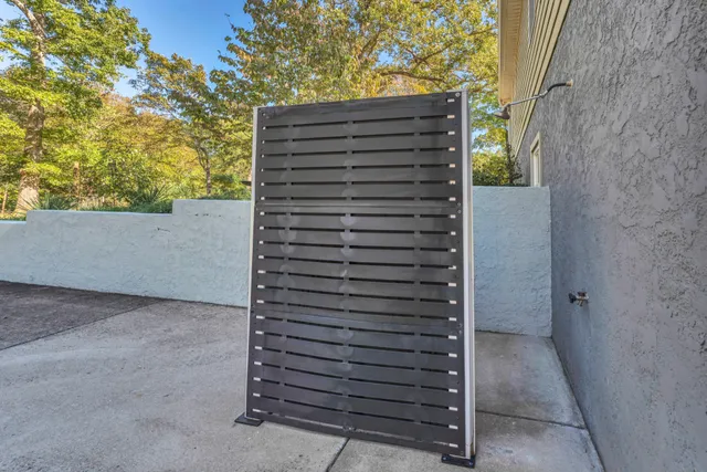 a view of a lush green forest with lots of trees