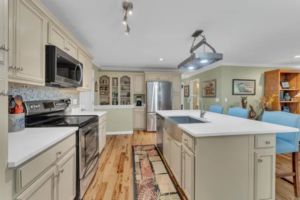 a kitchen that has a lot of cabinets in it
