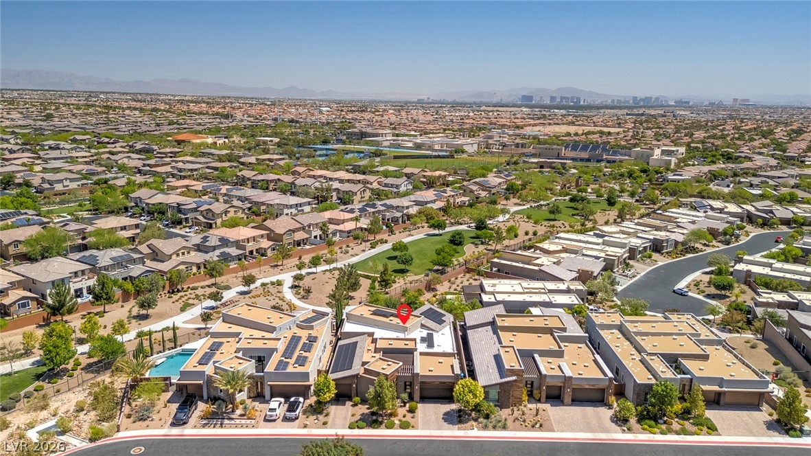 6014 Willow Ridge Court Las Vegas, NV 89135 - Photo 85 of 99 An aerial perspective reveals a vibrant neighborhood with an inviting community pool, and lush green spaces.