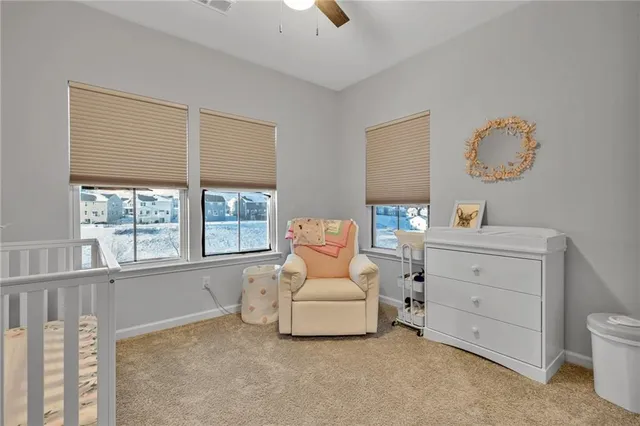 a living room with furniture cabinets and window