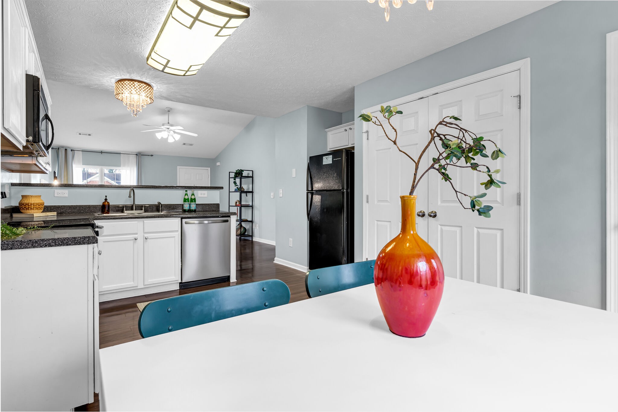 4026 Deer Run Trace Spring Hill, TN 37174 - Photo 13 of 29 a kitchen with stainless steel appliances kitchen island granite countertop a sink a refrigerator and window