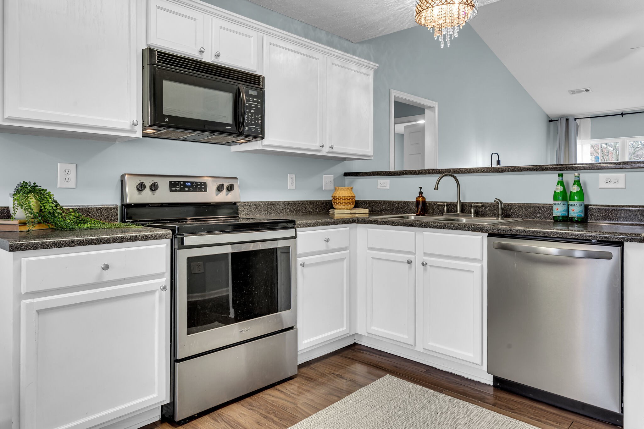 4026 Deer Run Trace Spring Hill, TN 37174 - Photo 15 of 29 a kitchen with stainless steel appliances granite countertop a sink a stove a microwave and cabinets