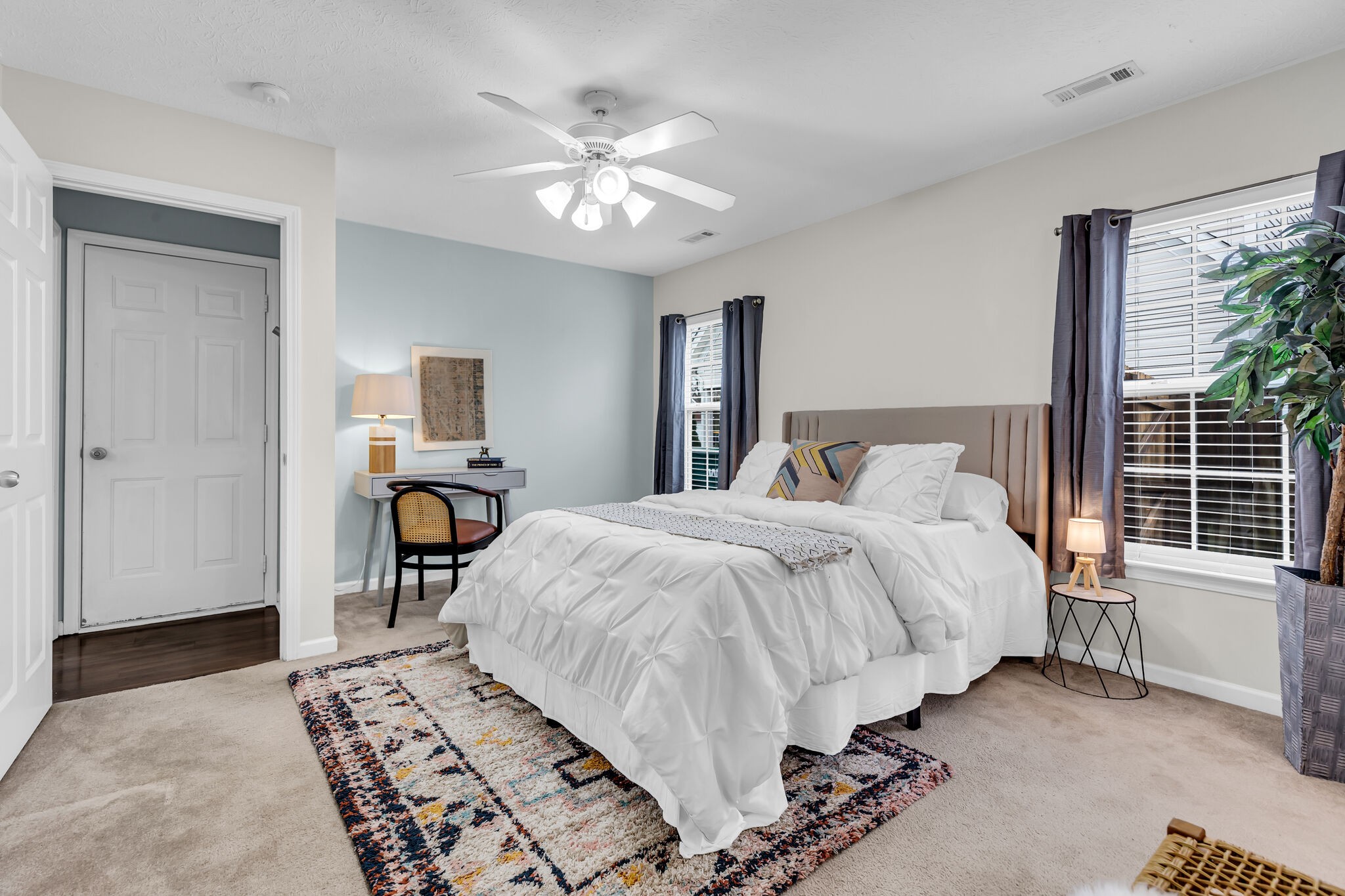 4026 Deer Run Trace Spring Hill, TN 37174 - Photo 17 of 29 a spacious bedroom with a bed and a chandelier