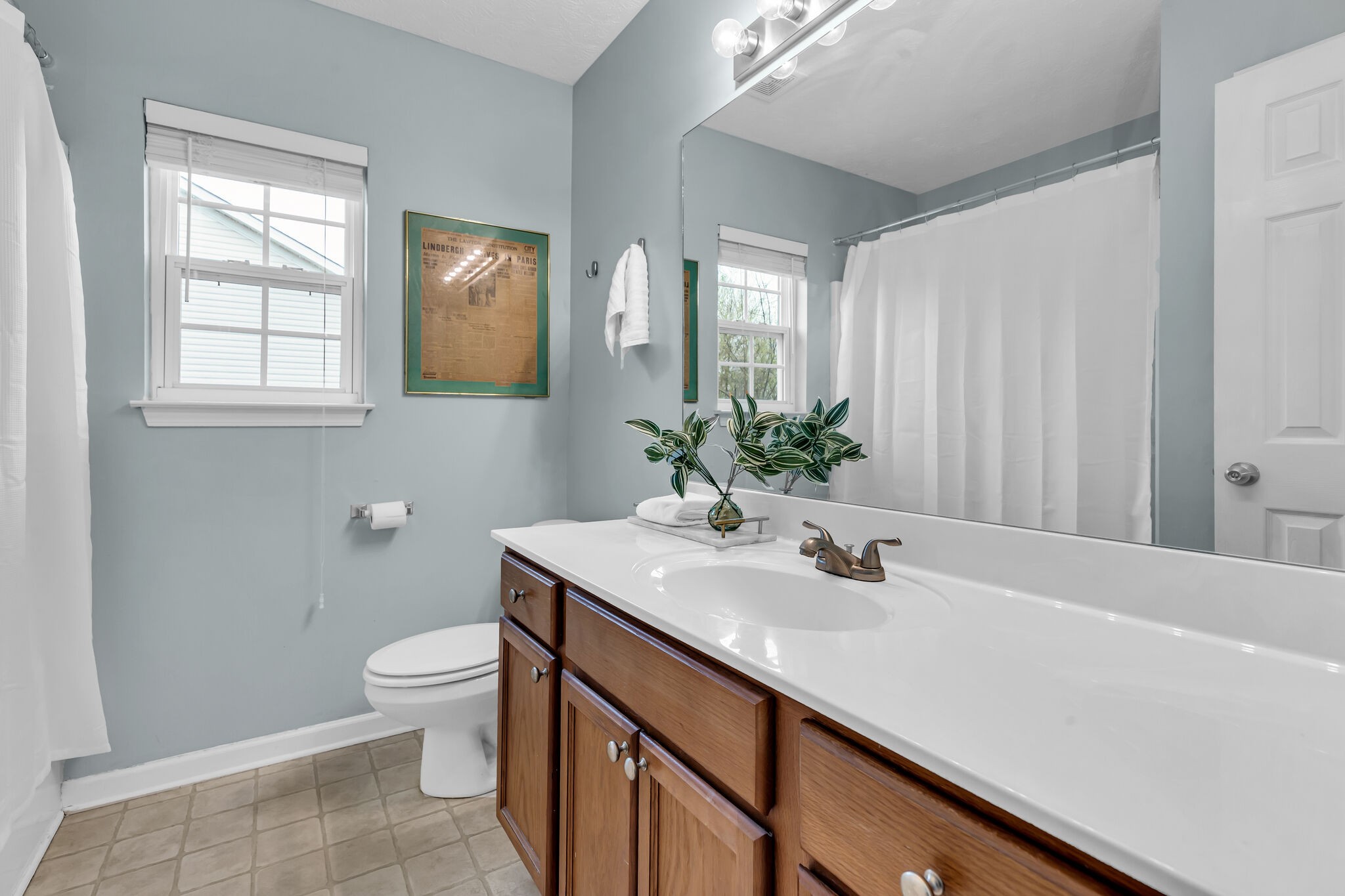 4026 Deer Run Trace Spring Hill, TN 37174 - Photo 20 of 29 a bathroom with a sink a toilet and mirror