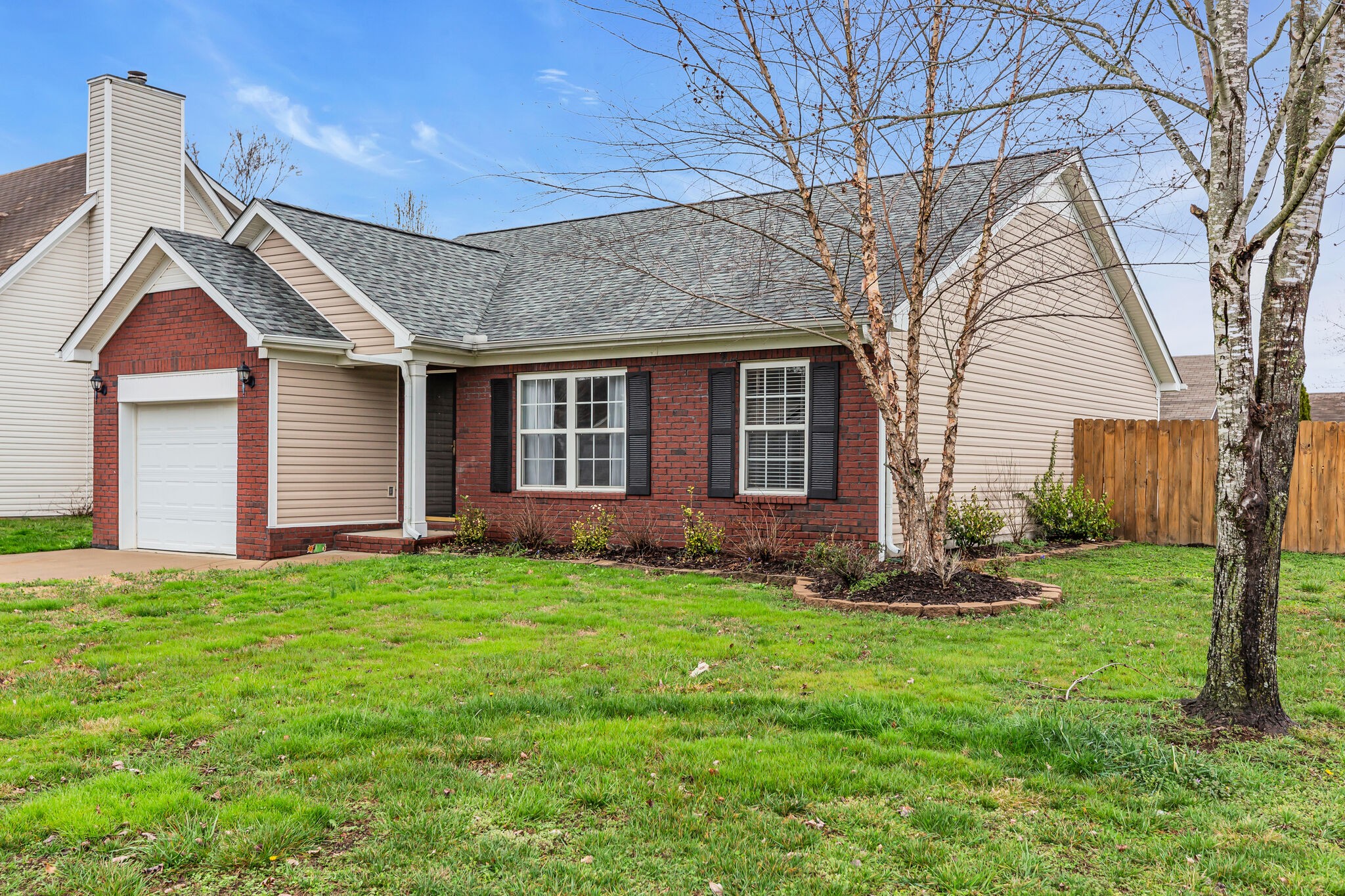 4026 Deer Run Trace Spring Hill, TN 37174 - Photo 2 of 29 a backyard of a house with lots of green space