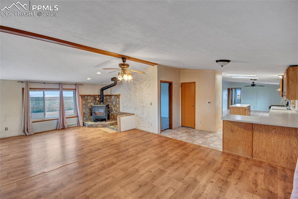 7940 Edison Road Yoder, CO 80864 - Photo 13 of 38 a view of a kitchen with a sink and a large window