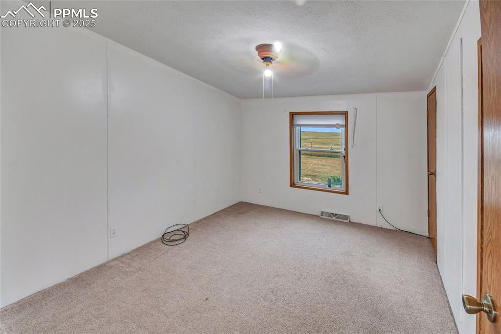 7940 Edison Road Yoder, CO 80864 - Photo 20 of 38 an empty room with windows