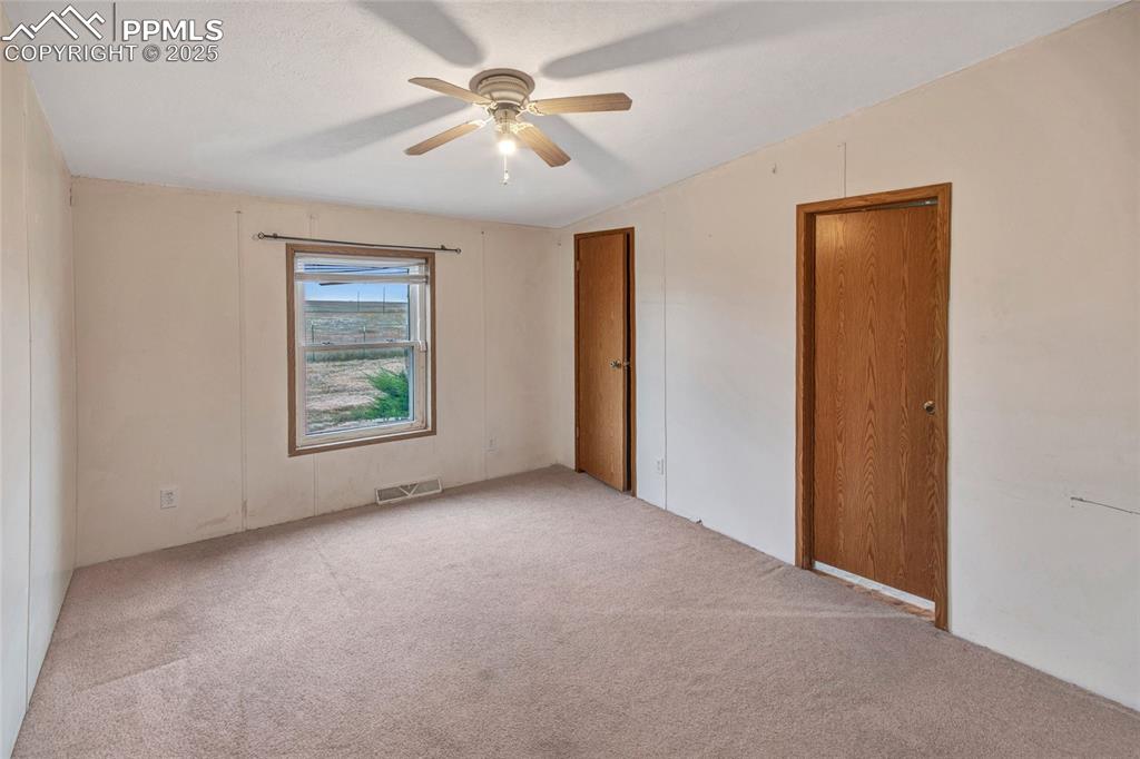 7940 Edison Road Yoder, CO 80864 - Photo 25 of 38 an empty room with windows and fan
