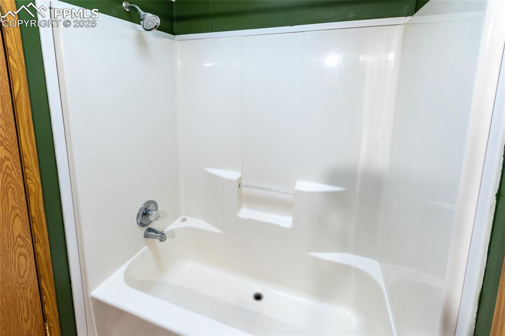 7940 Edison Road Yoder, CO 80864 - Photo 29 of 38 a bathroom with a white bath tub