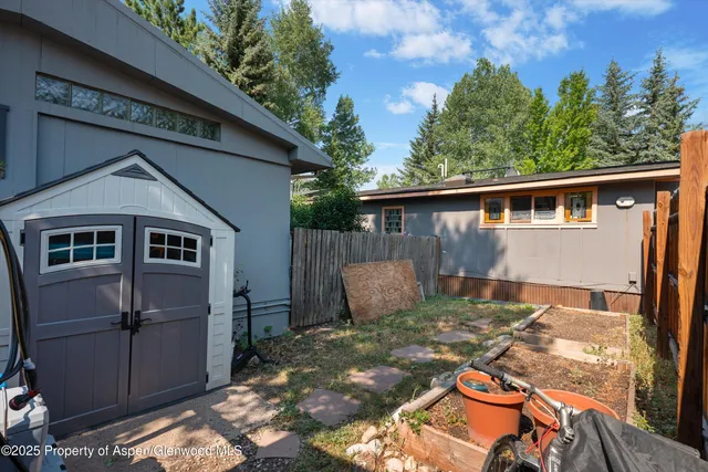 a view of a backyard with a patio
