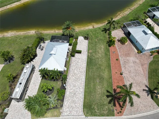 an aerial view of a house with yard