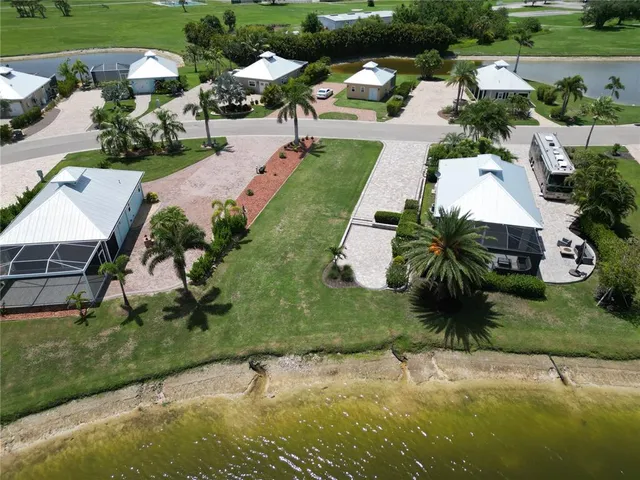 an aerial view of a house with garden space and street view