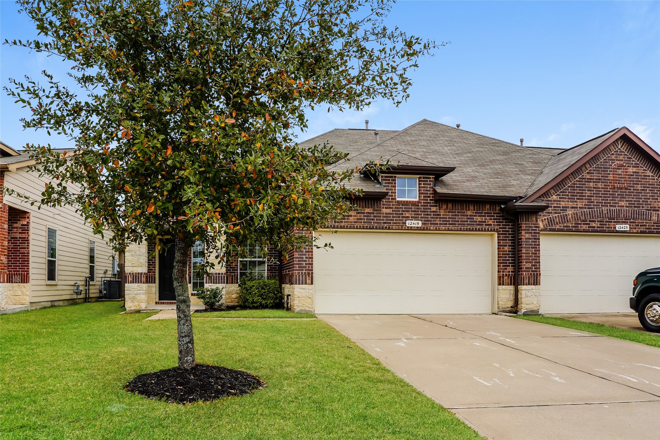 12419 Maura Lane Houston, TX 77044 - Photo 2 of 11 a front view of a house with garden