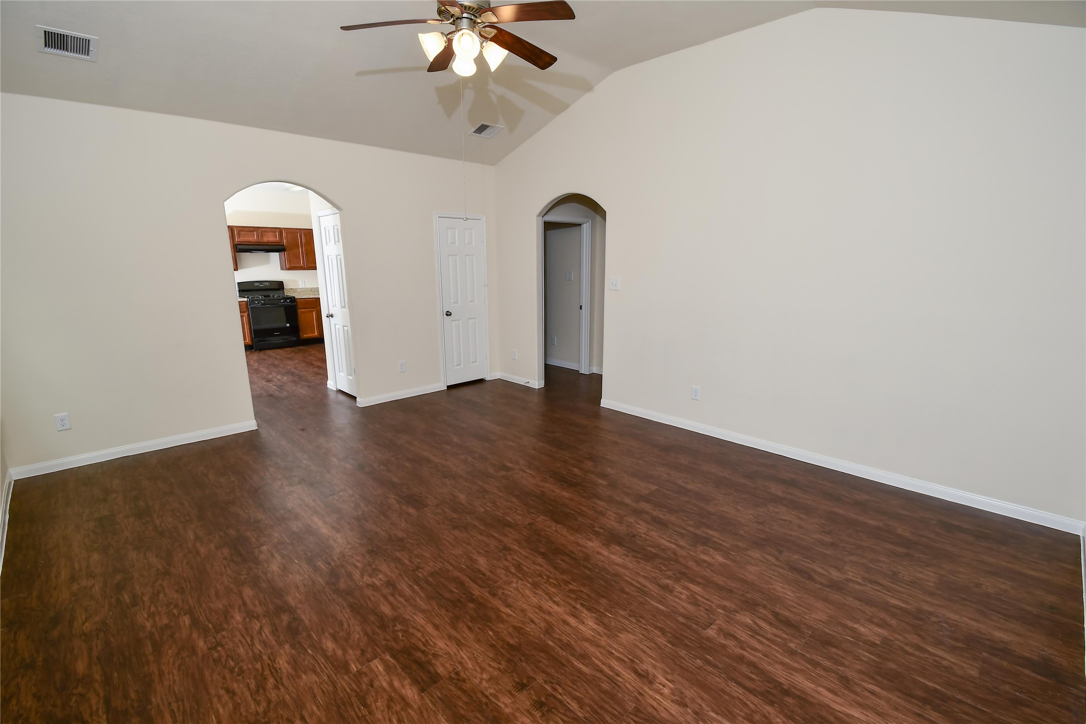 12419 Maura Lane Houston, TX 77044 - Photo 6 of 11 wooden floor in an empty room with a window