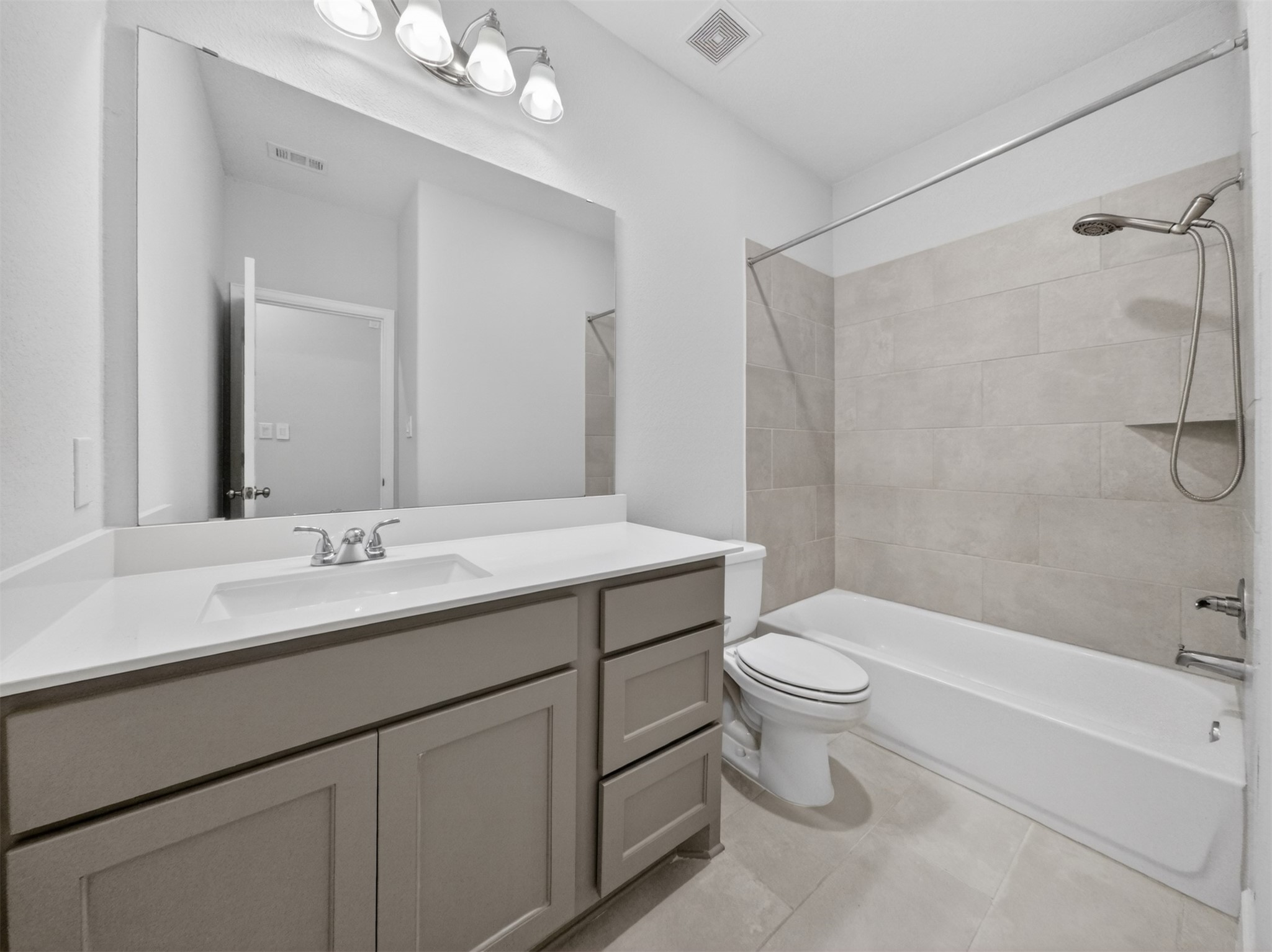 4343 Martin Ridge Drive Manvel, TX 77578 - Photo 35 of 50 a bathroom with a sink a toilet and shower