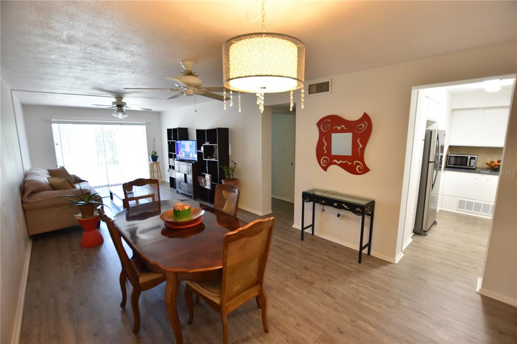 3900 Roxane Boulevard, Unit 10A Sarasota, FL 34235 - Photo 5 of 10 a dining room with furniture and window