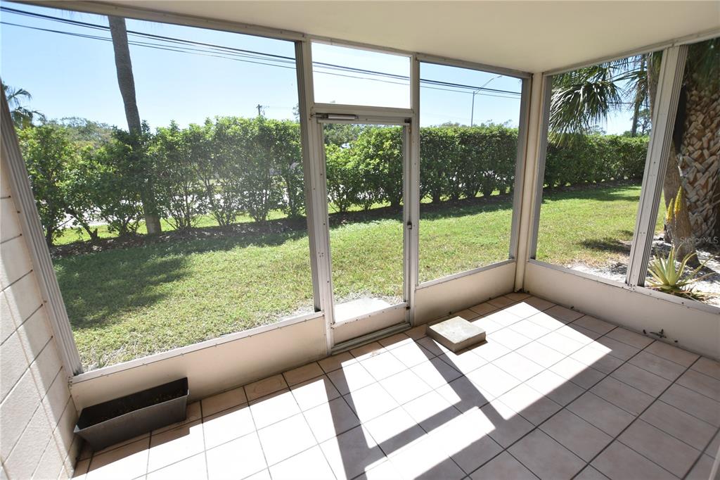 3900 Roxane Boulevard, Unit 10A Sarasota, FL 34235 - Photo 8 of 10 a view of a room that has a bed in it