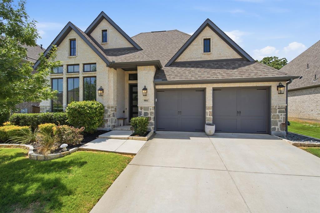 904 Fallbrook Avenue Denton, TX 76210 - Photo 2 of 30 a front view of a house with a yard and garage