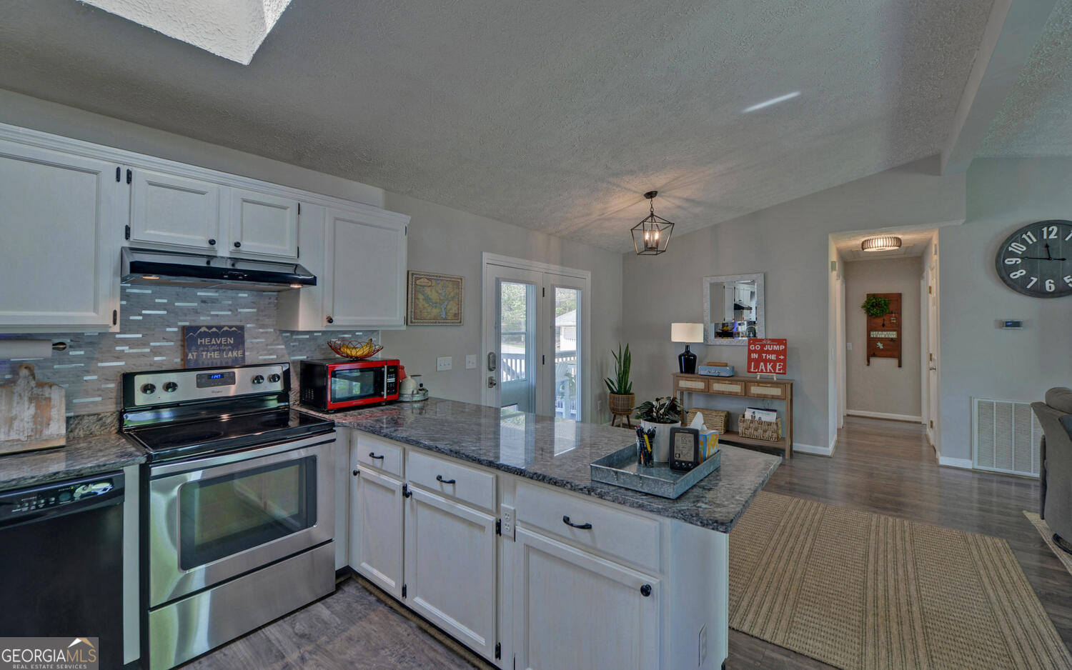 809 Glenn Ferry Road Fair Play, SC 29643 - Photo 17 of 78 a kitchen with granite countertop a sink cabinets and stainless steel appliances