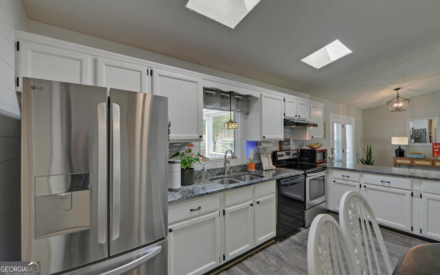 809 Glenn Ferry Road Fair Play, SC 29643 - Photo 19 of 78 a kitchen with stainless steel appliances a refrigerator stove and sink