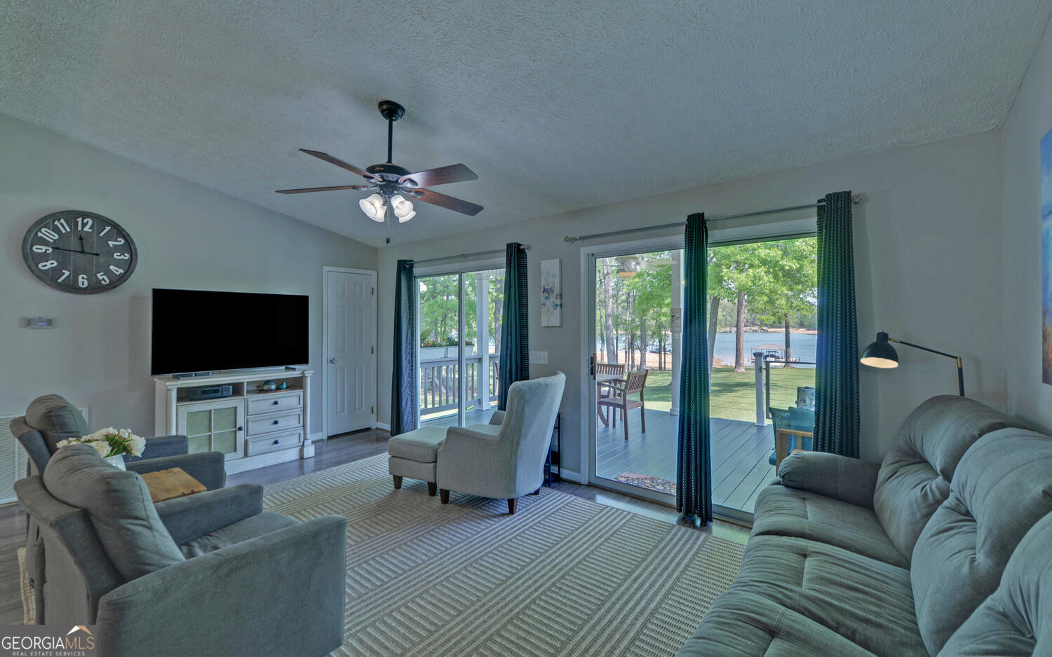 809 Glenn Ferry Road Fair Play, SC 29643 - Photo 26 of 78 a living room with furniture a flat screen tv and a large window