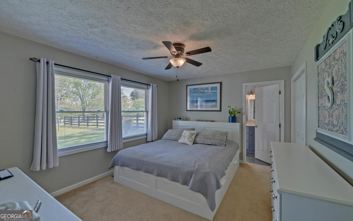 809 Glenn Ferry Road Fair Play, SC 29643 - Photo 37 of 78 a bedroom with a large bed and a chandelier