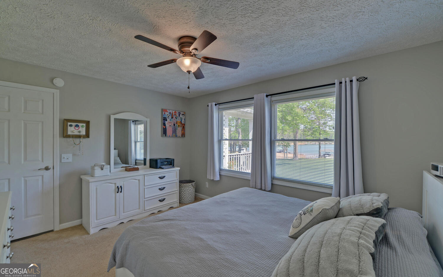 809 Glenn Ferry Road Fair Play, SC 29643 - Photo 38 of 78 a bedroom with a bed and a chandelier