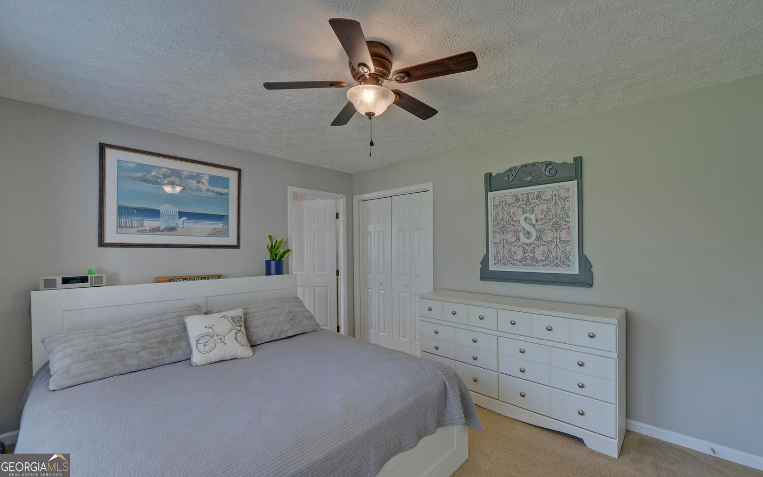 809 Glenn Ferry Road Fair Play, SC 29643 - Photo 39 of 78 a bedroom with a bed and a painting on the wall