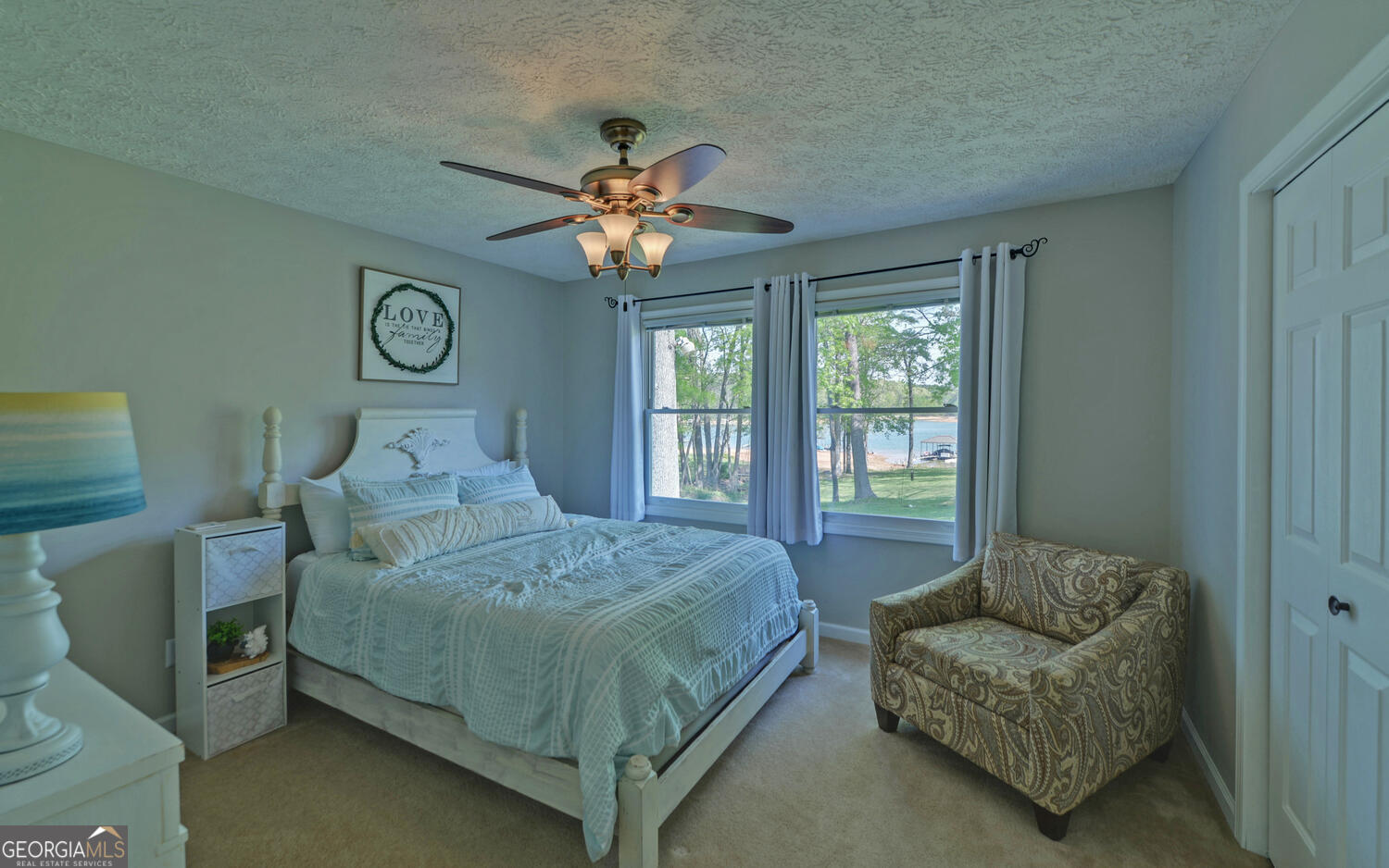 809 Glenn Ferry Road Fair Play, SC 29643 - Photo 48 of 78 a bedroom with a bed a couch and a large window