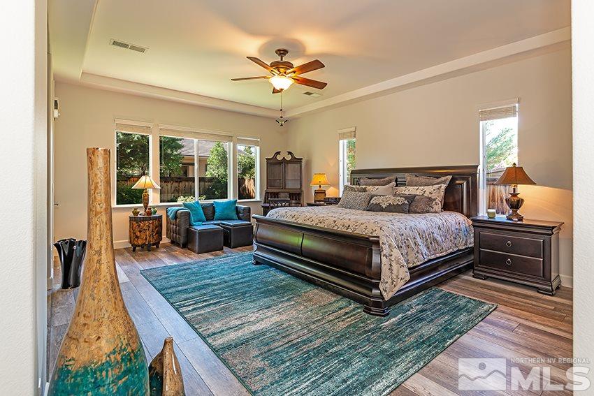 2675 Colmar Court Reno, NV 89521 - Photo 12 of 25 a bedroom with a bed and a table in it