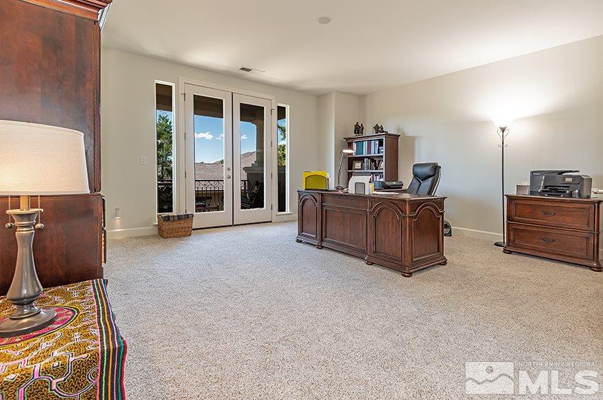2675 Colmar Court Reno, NV 89521 - Photo 19 of 25 a living room with furniture and a flat screen tv