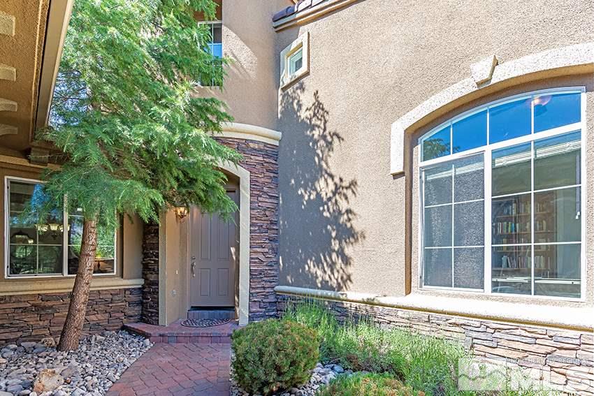 2675 Colmar Court Reno, NV 89521 - Photo 2 of 25 a front view of a house with a yard