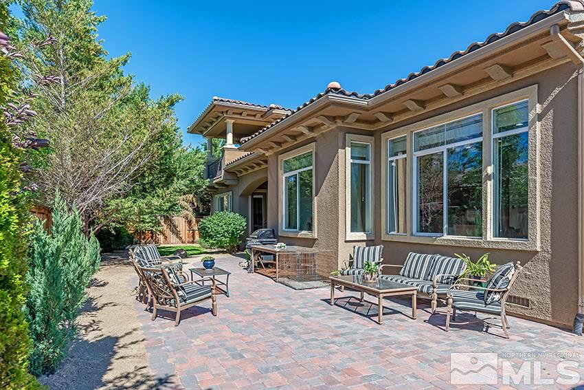 2675 Colmar Court Reno, NV 89521 - Photo 22 of 25 a view of a house with backyard sitting area and garden