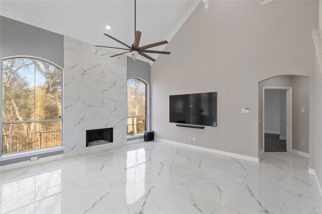 225 Freedom Court Rockwall, TX 75032 - Photo 7 of 28 a living room with furniture and a flat screen tv