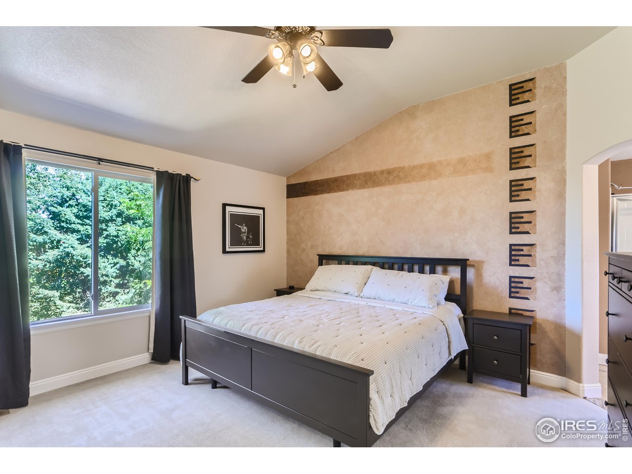 6626 Silverleaf Avenue Firestone, CO 80504 - Photo 11 of 27 a bedroom with a bed lamp and a window