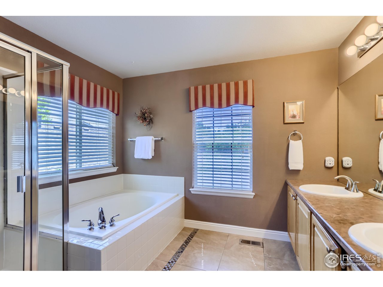 6626 Silverleaf Avenue Firestone, CO 80504 - Photo 12 of 27 a bathroom with a tub sink and a mirror