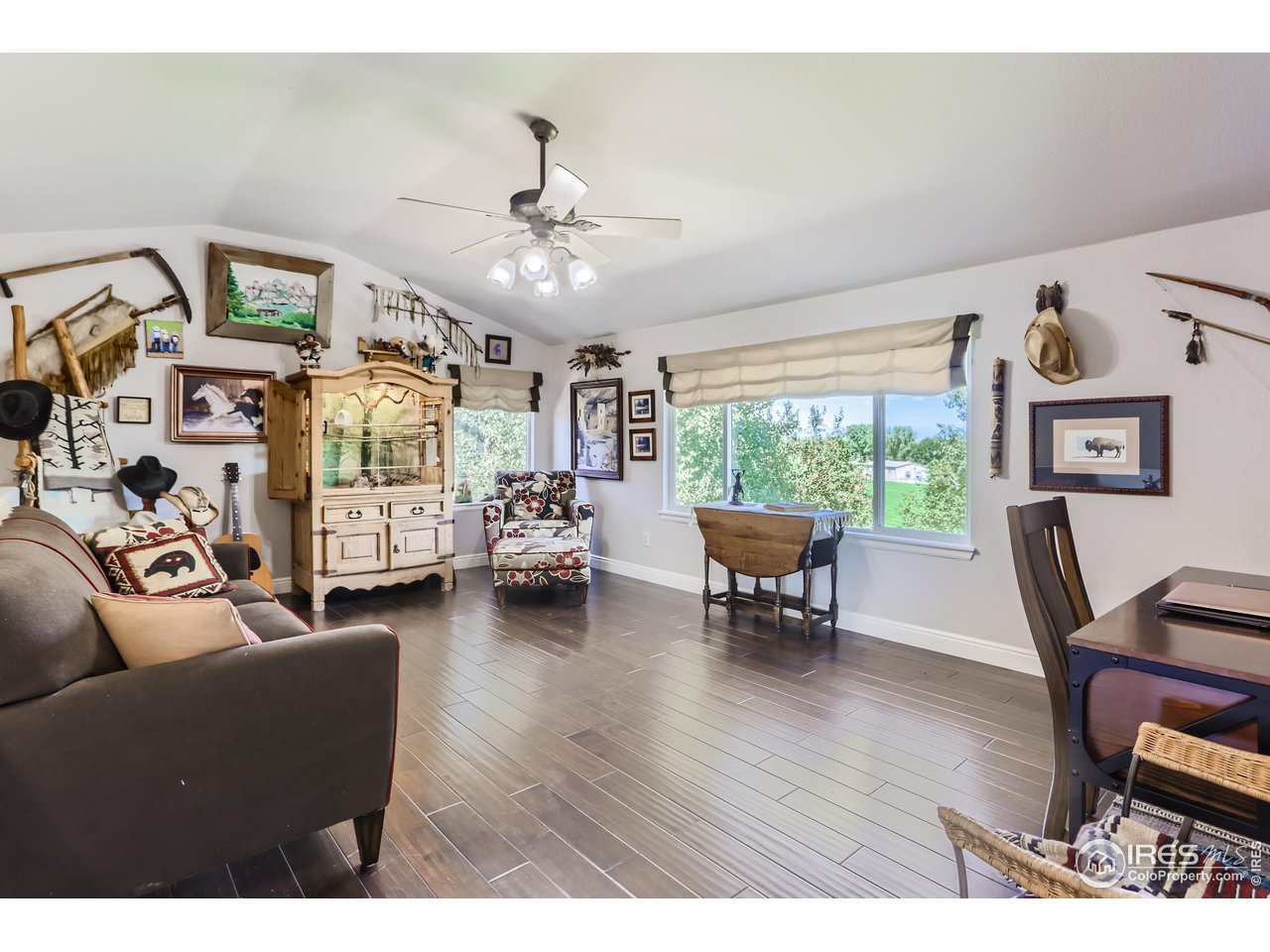 6626 Silverleaf Avenue Firestone, CO 80504 - Photo 17 of 27 a living room with furniture and a large window