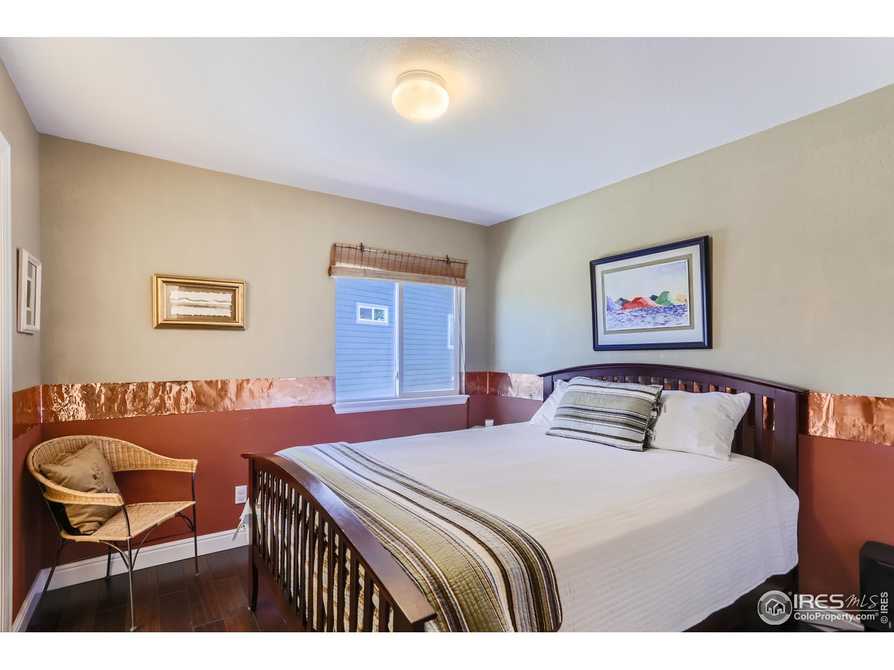 6626 Silverleaf Avenue Firestone, CO 80504 - Photo 19 of 27 a bedroom with a bed and a chair