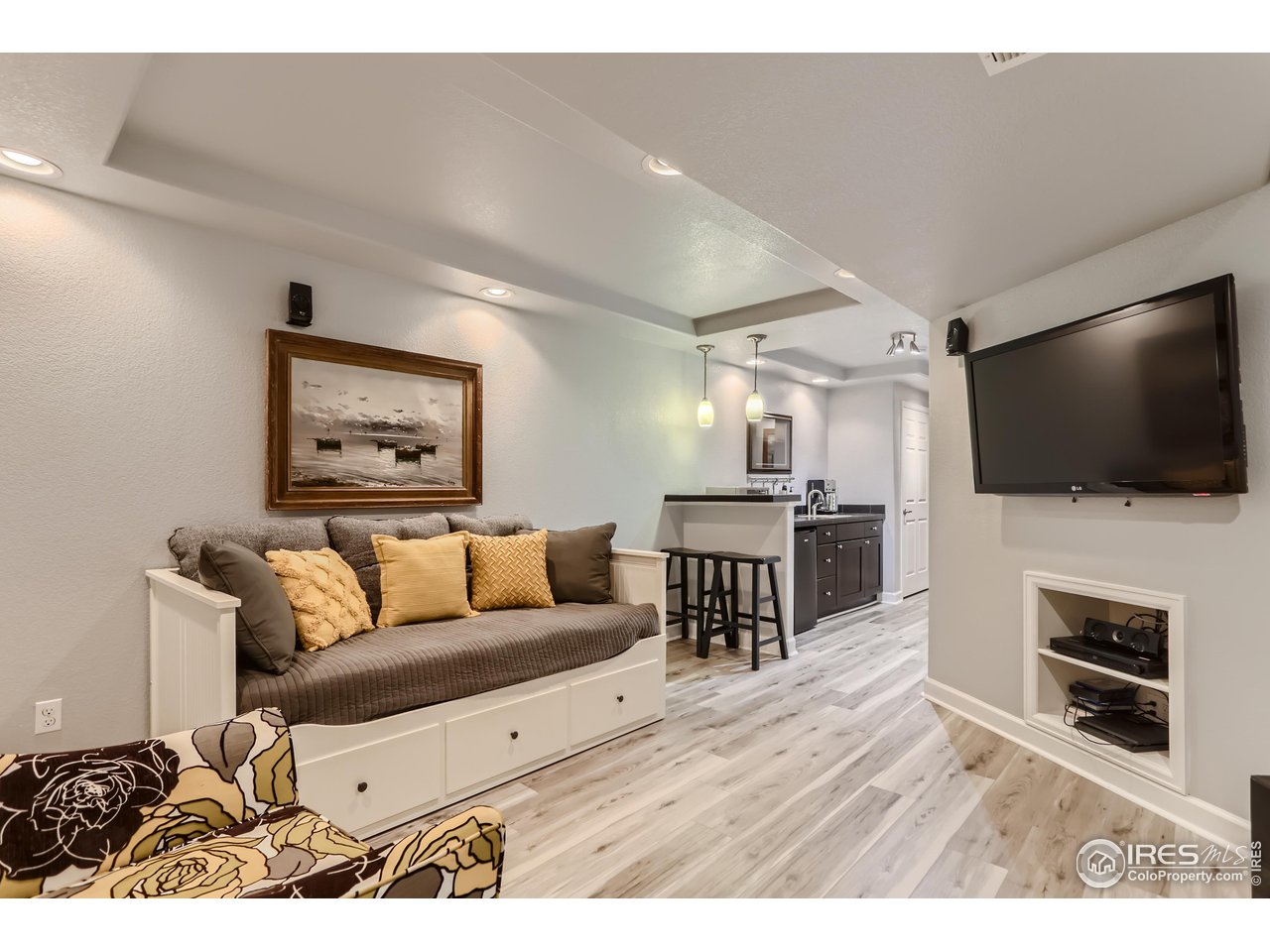 6626 Silverleaf Avenue Firestone, CO 80504 - Photo 20 of 27 a living room with furniture and a flat screen tv