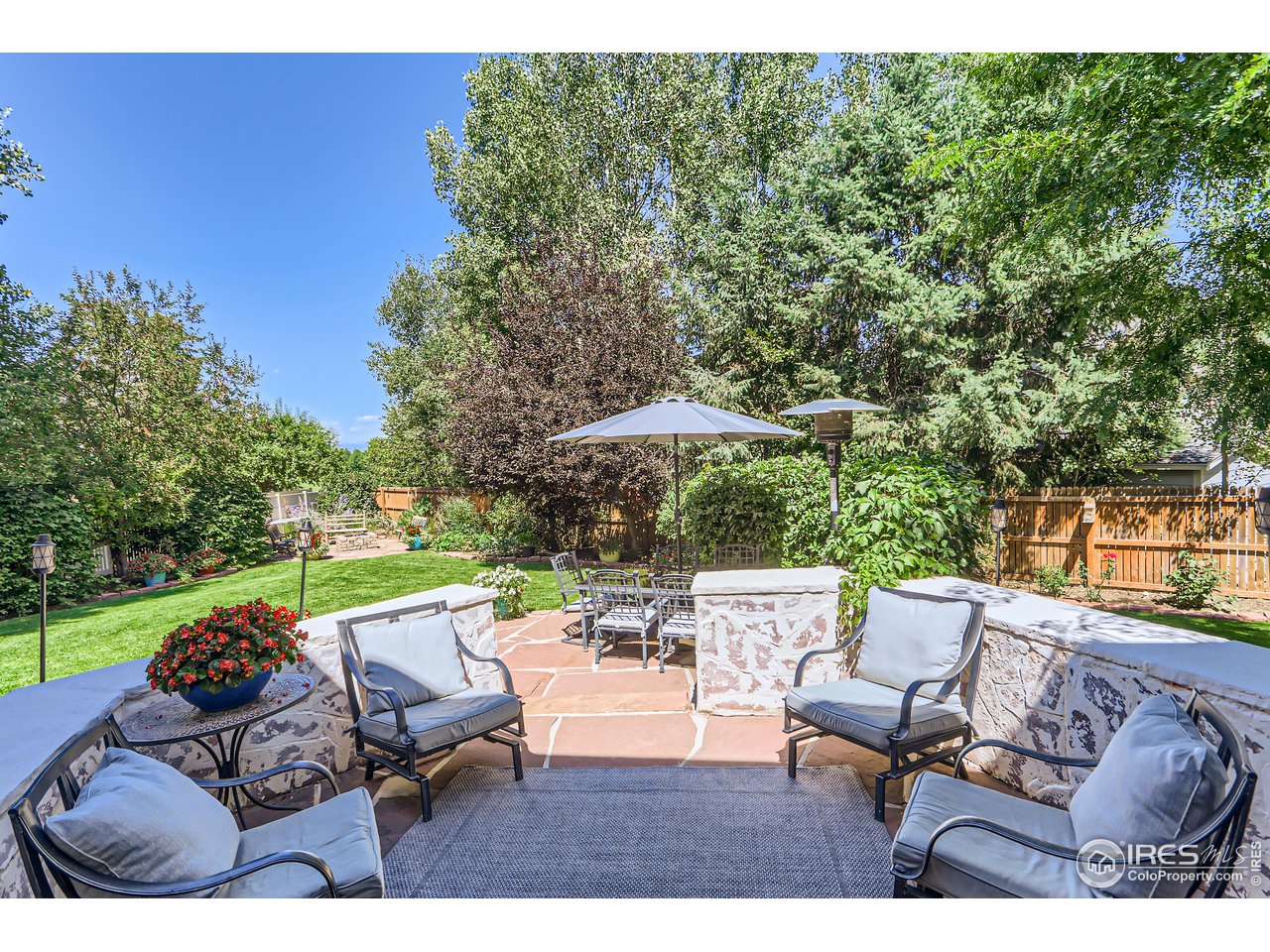 6626 Silverleaf Avenue Firestone, CO 80504 - Photo 24 of 27 a view of backyard with seating space and trees in the background