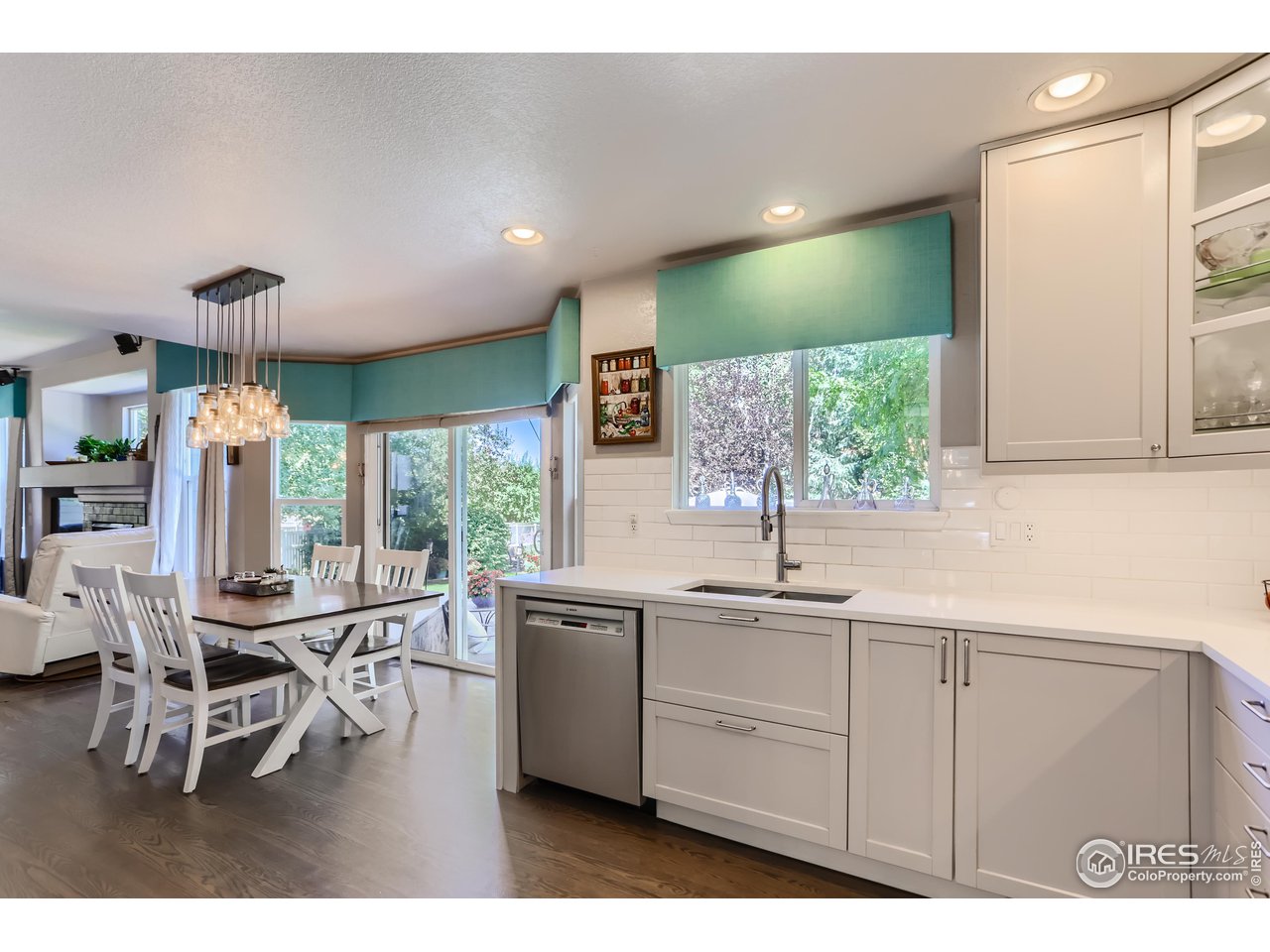 6626 Silverleaf Avenue Firestone, CO 80504 - Photo 5 of 27 a kitchen with a sink cabinets and dining table chair