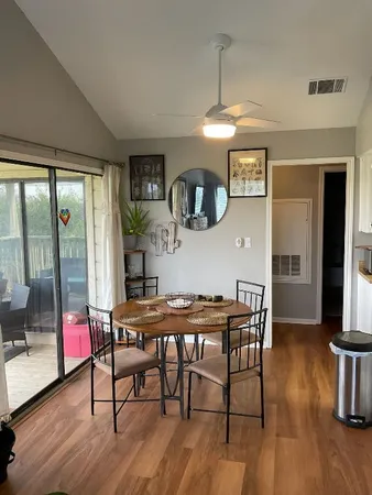a view of a dining room with furniture window and wooden floor